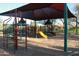 Community playground with climbing structures, slides, and shade, providing a fun and safe play area at 2425 W Bronco Butte Trl # 1002, Phoenix, AZ 85085