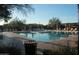 Resort-style pool offers lounge chairs, shade, and clear blue water for relaxation and community enjoyment at 2425 W Bronco Butte Trl # 1002, Phoenix, AZ 85085