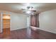 Inviting bedroom with dark wood floors and a well-lit ceiling fan at 10309 W Santiago Dr, Arizona City, AZ 85123