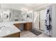 Well-lit primary bathroom boasts double sinks, a large mirror, and a glass-enclosed shower at 1451 E Palm Beach Dr, Chandler, AZ 85249