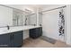 Clean bathroom with dual sinks, modern fixtures, and white subway tile shower at 1451 E Palm Beach Dr, Chandler, AZ 85249