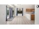 Bright kitchen features tile flooring, oak cabinets, stainless sink, and breakfast nook at 1451 E Palm Beach Dr, Chandler, AZ 85249