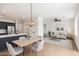 Bright open floor plan featuring dining area, living room with fan, and modern finishes at 1451 E Palm Beach Dr, Chandler, AZ 85249