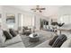 Bright living room with neutral tones, modern decor, and an open layout to the dining area at 1451 E Palm Beach Dr, Chandler, AZ 85249