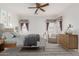 Cozy bedroom featuring large windows with decorative curtains, complemented by classic furnishings and decor at 1451 E Palm Beach Dr, Chandler, AZ 85249