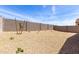 This zero-scape backyard features a block wall and desert landscaping at 18162 W Cielo Grande Ave, Surprise, AZ 85387