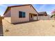 This backyard includes low-maintenance landscaping and a block fence at 18162 W Cielo Grande Ave, Surprise, AZ 85387