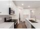 Bright kitchen features white cabinets, stainless steel appliances, and tile backsplash at 18162 W Cielo Grande Ave, Surprise, AZ 85387