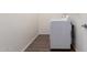 This laundry room features white appliances and tile flooring at 18162 W Cielo Grande Ave, Surprise, AZ 85387