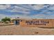 Dreamland Villa, a 55+ Community, welcomes residents with a brick sign and desert landscaping against a blue, partly cloudy sky at 5510 E Colby St, Mesa, AZ 85205