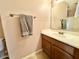 Bathroom with a single sink vanity and large mirror at 23200 W Ashleigh Marie Dr, Buckeye, AZ 85326