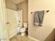 Bathroom with a standard shower and toilet at 23200 W Ashleigh Marie Dr, Buckeye, AZ 85326