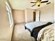 Bedroom with a ceiling fan and view from the window for natural light at 23200 W Ashleigh Marie Dr, Buckeye, AZ 85326