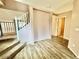 Inviting entryway featuring a staircase, wood-like floors, and access to other rooms in the home at 23200 W Ashleigh Marie Dr, Buckeye, AZ 85326