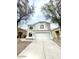 Two-story home featuring a spacious two car garage and well-maintained front yard at 23200 W Ashleigh Marie Dr, Buckeye, AZ 85326