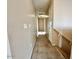 Hallway featuring neutral walls and carpet leading to other rooms in the home at 23200 W Ashleigh Marie Dr, Buckeye, AZ 85326