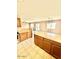 Kitchen island in a space with light wood cabinets and flooring at 23200 W Ashleigh Marie Dr, Buckeye, AZ 85326