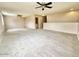 Large upstairs loft with plush carpeting and ceiling fans at 23200 W Ashleigh Marie Dr, Buckeye, AZ 85326