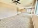 Large carpeted loft area with ceiling fans and natural light at 23200 W Ashleigh Marie Dr, Buckeye, AZ 85326