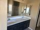 Double vanity bathroom featuring framed mirrors and walk-in shower at 29101 N Yellow Bee Dr, San Tan Valley, AZ 85143