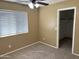 Cozy bedroom featuring neutral carpet, a ceiling fan, and a window letting in natural light at 29101 N Yellow Bee Dr, San Tan Valley, AZ 85143