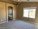 Cozy bedroom featuring carpet, natural light, and ensuite bathroom at 29101 N Yellow Bee Dr, San Tan Valley, AZ 85143