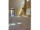 Bright living area with new carpet, recessed lighting, and a view to the kitchen and backyard at 29101 N Yellow Bee Dr, San Tan Valley, AZ 85143