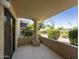 Covered patio with tiled flooring and a view of the lush landscaping at 8649 E Royal Palm Rd # 131, Scottsdale, AZ 85258