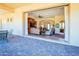 View from patio into living room with refined finishes and large sliding doors for indoor-outdoor living at 37269 N 100Th Pl, Scottsdale, AZ 85262