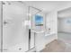 Modern bathroom featuring a glass shower and soaking tub, perfect for relaxation at 10864 E Texas Ave, Mesa, AZ 85212
