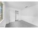 Bedroom showcasing neutral carpet, white walls, and closet with sliding doors at 10864 E Texas Ave, Mesa, AZ 85212