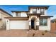 Charming two-story home featuring a two-car garage and a well-maintained front yard at 10864 E Texas Ave, Mesa, AZ 85212