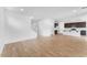 Open concept living room featuring hardwood floors and ample natural light at 10864 E Texas Ave, Mesa, AZ 85212