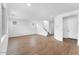 Spacious living room featuring hardwood floors, bright white walls, and ample natural light at 10864 E Texas Ave, Mesa, AZ 85212