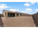 Expansive backyard with a covered patio, offering ample space for outdoor activities and landscaping possibilities at 7691 W Cactus Wren Way, Florence, AZ 85132