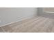 An empty bedroom features neutral carpet, white walls, baseboards, and a window with blinds for an uncluttered and serene space at 7691 W Cactus Wren Way, Florence, AZ 85132