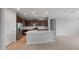 Modern kitchen featuring stainless steel appliances, island, and dark cabinets at 7691 W Cactus Wren Way, Florence, AZ 85132