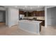 Beautiful kitchen with a center island, stainless appliances, and dark cabinetry at 7691 W Cactus Wren Way, Florence, AZ 85132
