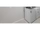Bright laundry room with a modern washer and dryer on a tile floor at 7691 W Cactus Wren Way, Florence, AZ 85132