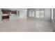 Open living area with tile floors flowing into the kitchen with an island at 7691 W Cactus Wren Way, Florence, AZ 85132