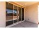 Covered back patio featuring sliding glass doors and a concrete floor at 12333 W Marguerite Ave, Avondale, AZ 85323