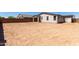 Spacious dirt backyard enclosed by a block wall, perfect for creating a private oasis at 12333 W Marguerite Ave, Avondale, AZ 85323