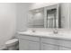 Well-lit bathroom showcasing double sinks, vanity, and toilet at 12333 W Marguerite Ave, Avondale, AZ 85323