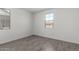 Bright bedroom with tile flooring and window with outside view at 12333 W Marguerite Ave, Avondale, AZ 85323