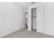 View of bedroom with neutral carpet, paint and walk-in closet at 12333 W Marguerite Ave, Avondale, AZ 85323