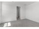 View of bedroom with neutral carpet, paint and walk-in closet at 12333 W Marguerite Ave, Avondale, AZ 85323