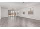 Expansive living room boasting modern tile flooring and sliding glass doors that lead to the backyard at 12333 W Marguerite Ave, Avondale, AZ 85323