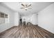 Expansive living room featuring wood flooring and an open layout, seamlessly connecting to the kitchen area at 24629 W St Catherine Ave, Buckeye, AZ 85326