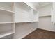 A walk-in closet featuring built-in shelving at 29449 N Sorrento Dr, Peoria, AZ 85383