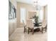 Elegant dining room with chandelier and modern decor at 4137 E Sourwood Dr, Gilbert, AZ 85298